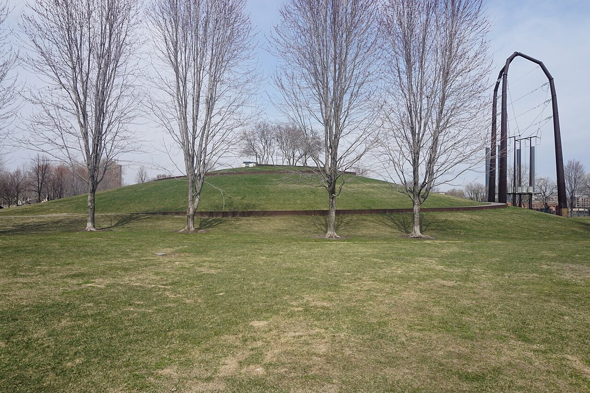 The grassy mound and skyline view at Gold Medal Park