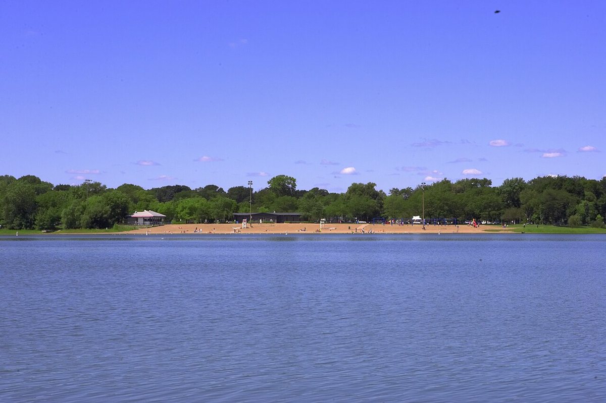 Swimmers and sailboats on Lake Nokomis