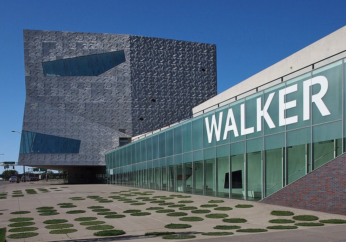 a couple viewing an exhibit inside the Walker Art Center